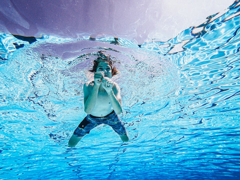 Teenager swimming in a pool