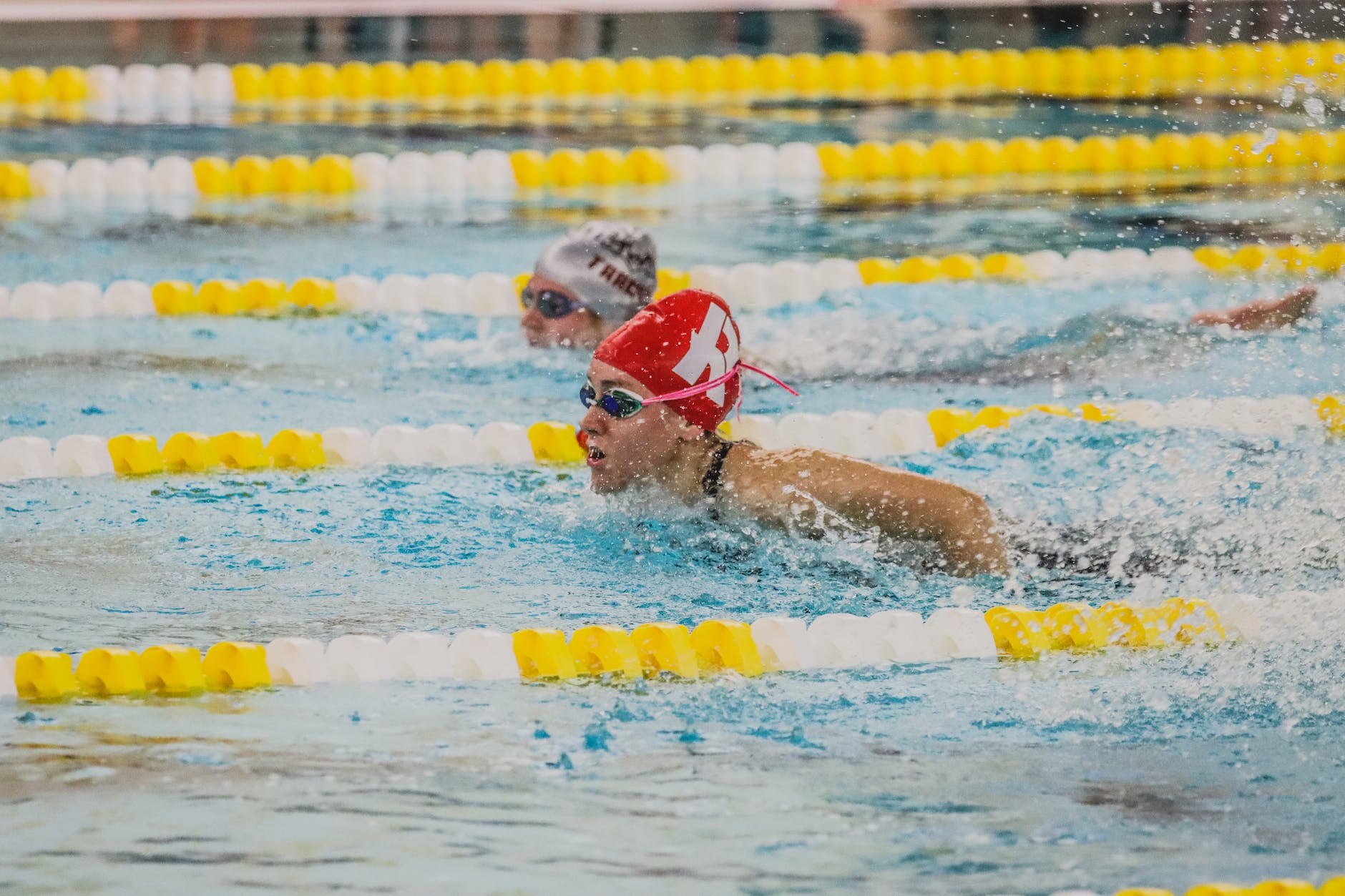 person in black swimming goggles in water