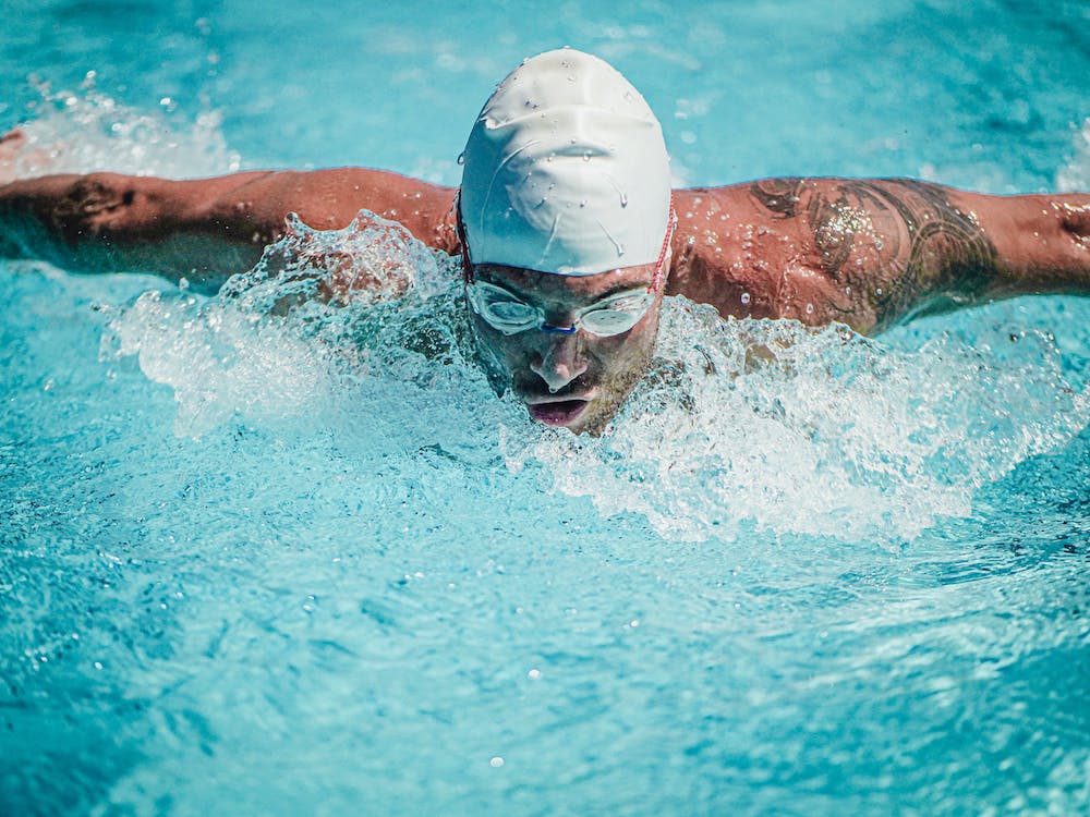 male swimmer practicing the breathing techniques