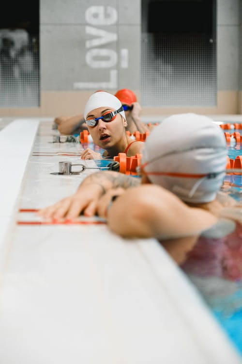 female swim captain giving speech to her teammates