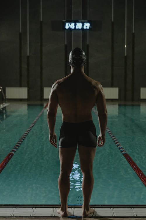 a male swimmer with well-developed shoulders and back muscles