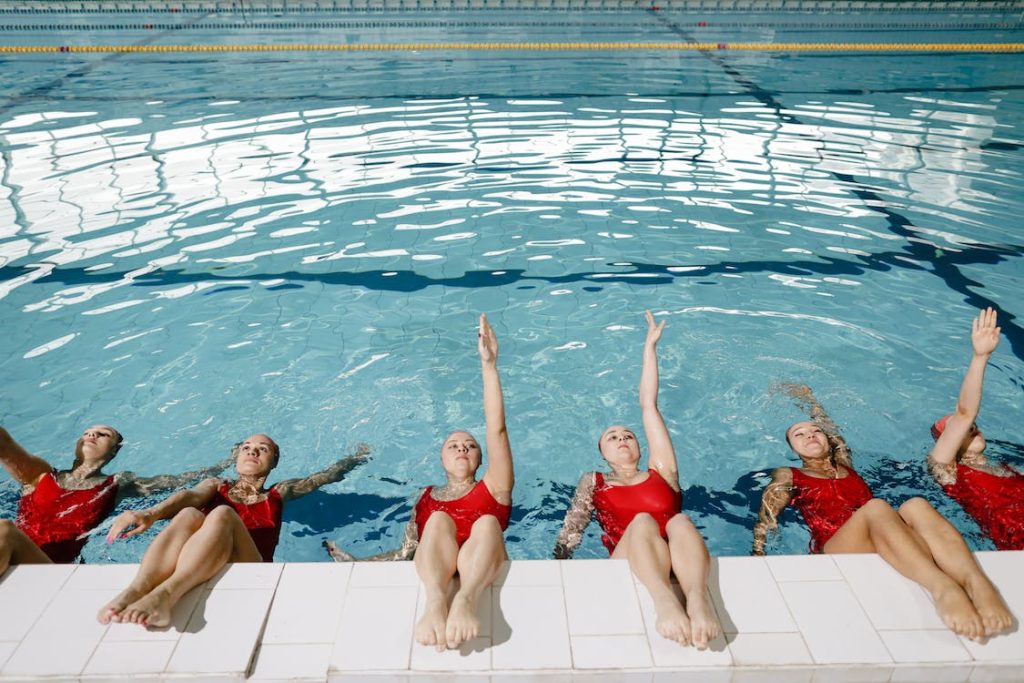 ladies swimming at a group swim lesson