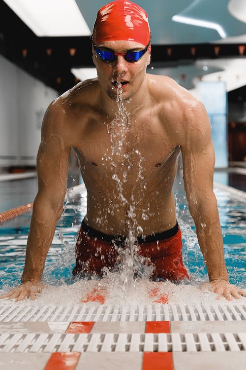 male swimmer with red cap experiencing the swimmer's high